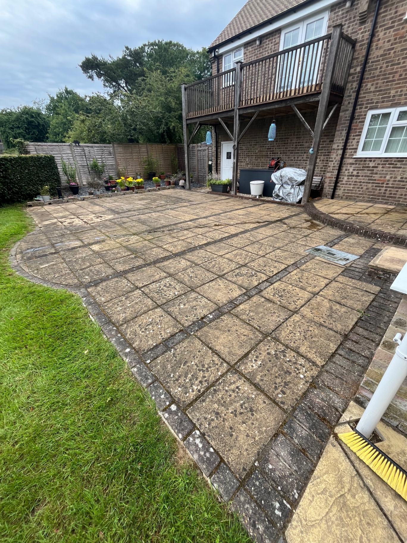 Patio before cleaning with heavy staining