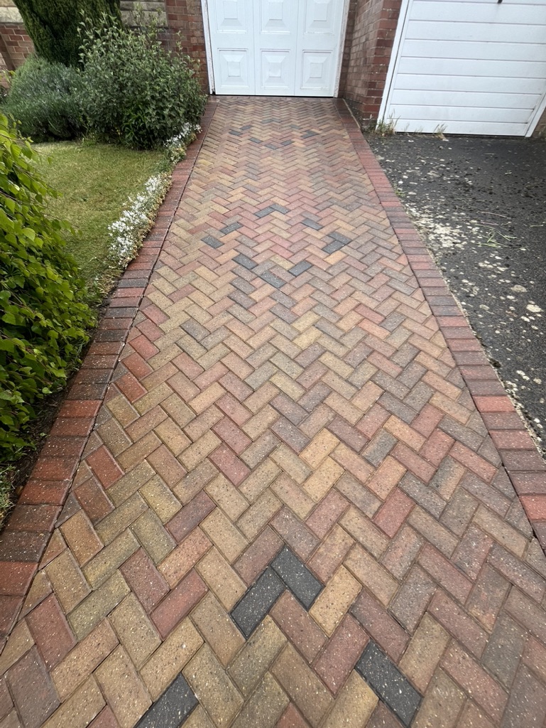 Herringbone block paved driveway after cleaning