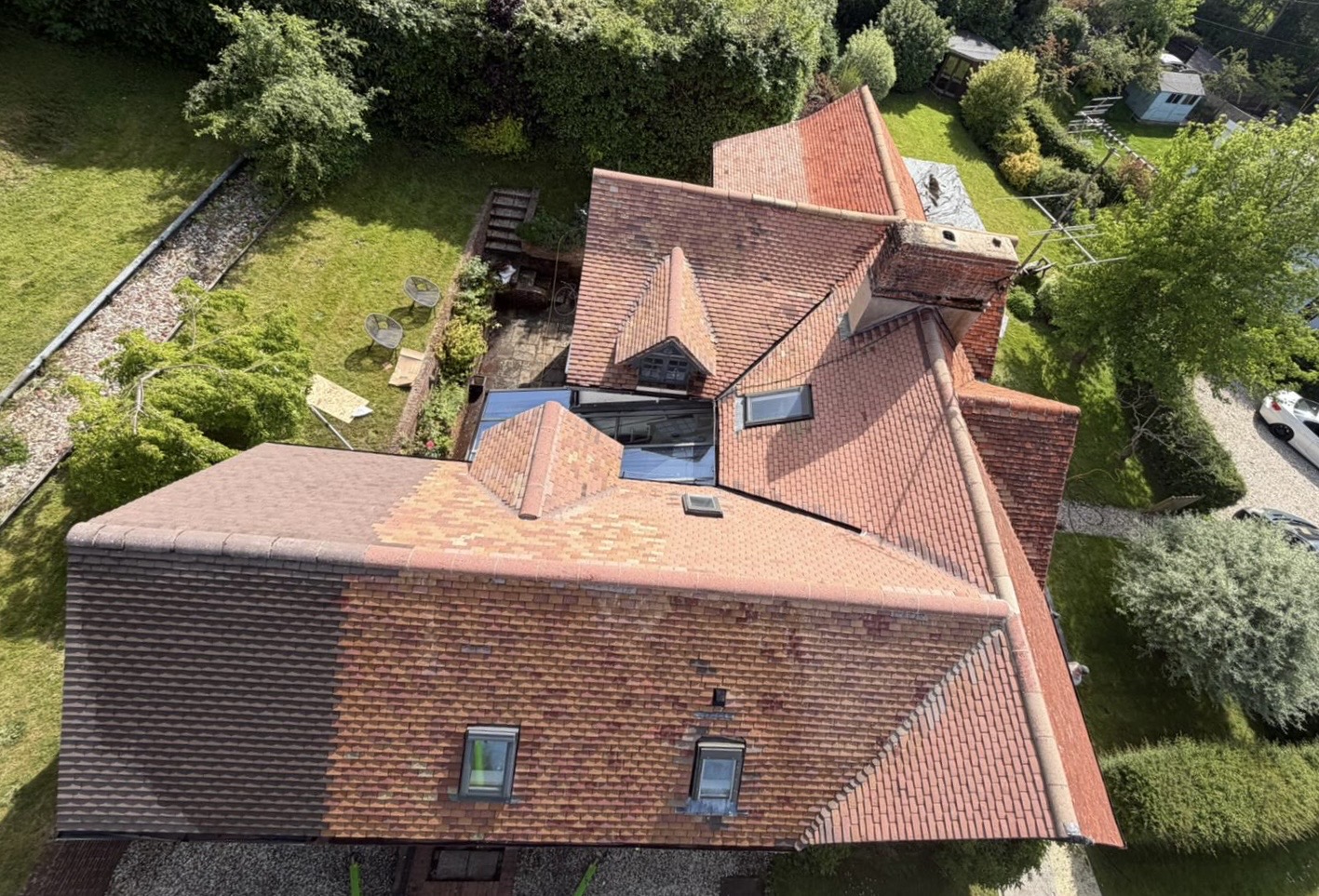 Aerial view of the same tiled roof after softwash cleaning