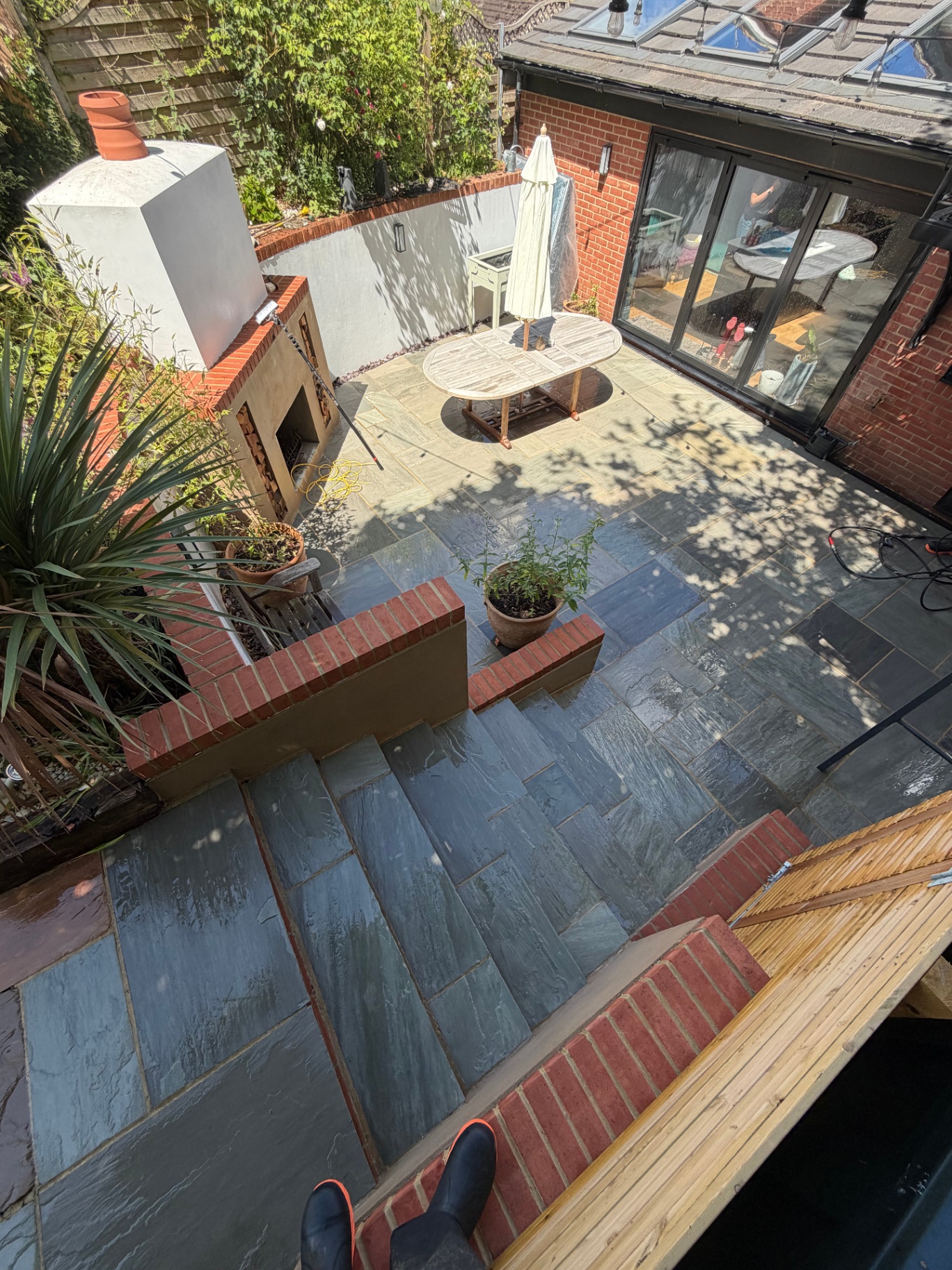 Overhead view of slate patio restored to clean finish after cleaning