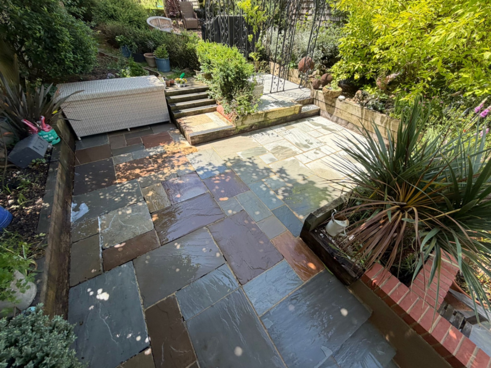 Sandstone patio after cleaning with restored natural colours